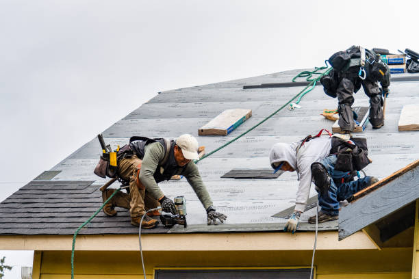 Professional Emergency Roof Repair technician working in East Walpole, MA